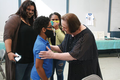 Janice Sartin greets a former daycare student