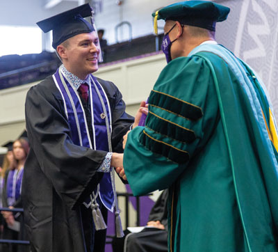 Landon Fisher receives his diploma