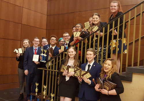 The Speaking Bearcats display their awards from the 2019 state championship.