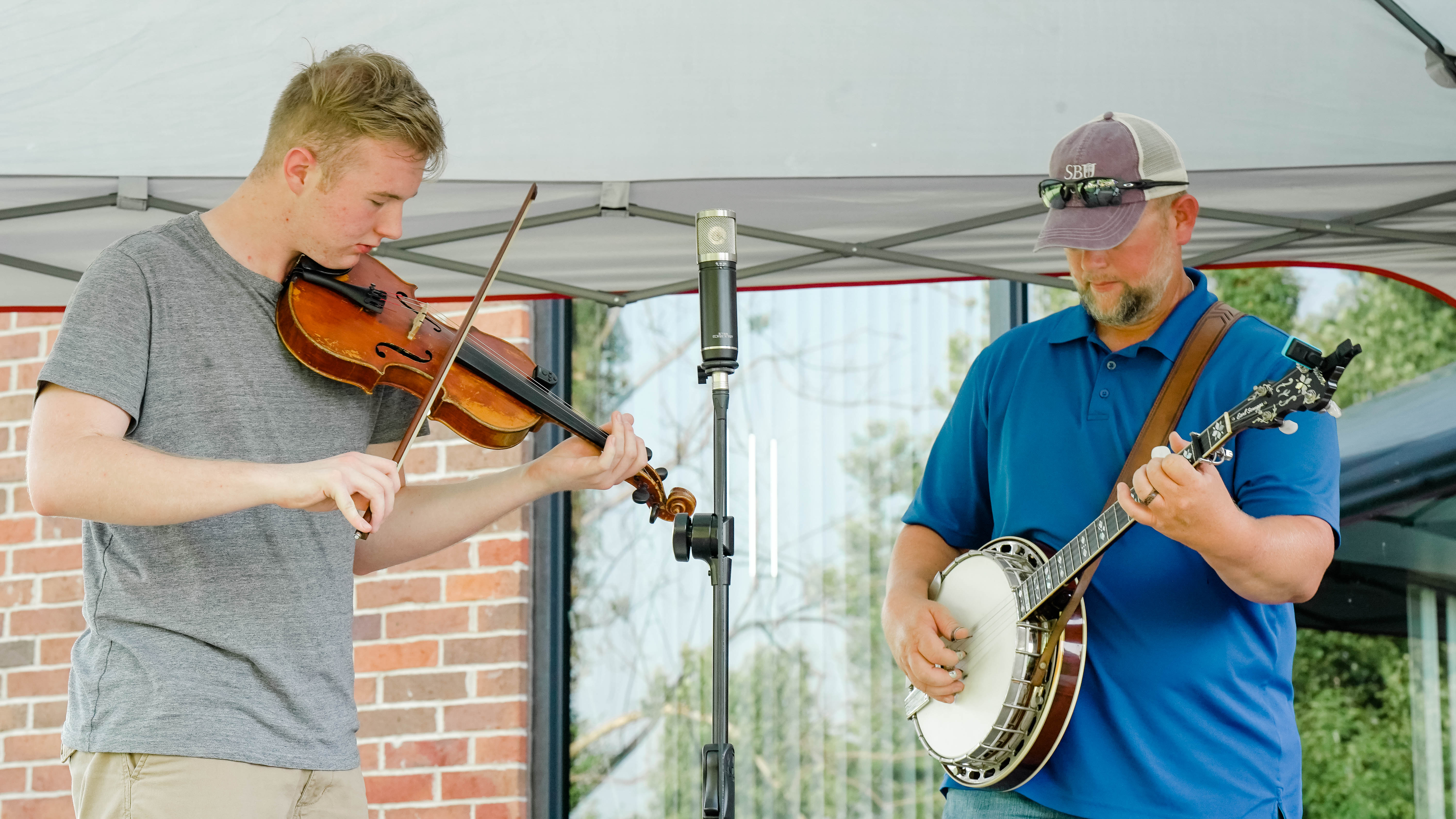 Jaron and Ronnie Bryant playing fiddle and banjo