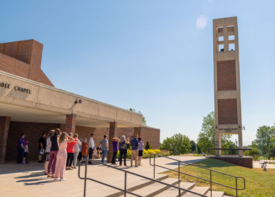 People gather at SBU's bell tower
