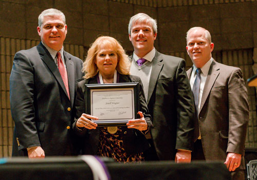 Jenell Wagner is recognized as the Ed and Theo Clark Endowed Chair of Accounting Excellence by (from left) SBU President Dr. Eric A. Turner; Dr. Lee Skinkle, provost; and Dr. Troy Bethards, dean of Robert W. Plaster College of Business and Computer Science.  