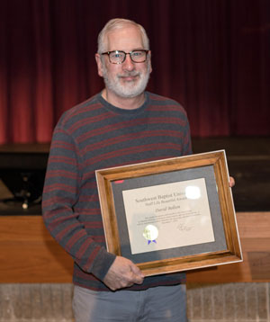 David Bolton holds his Life Beautiful Award