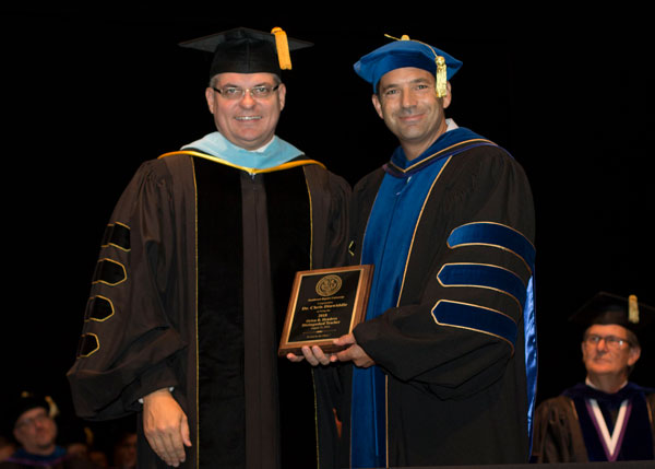 SBU president-elect Dr. Eric A. Turner presents Dr. Chris Dinwiddie with the Orien B. Hendrex Distinguished Teacher Award.