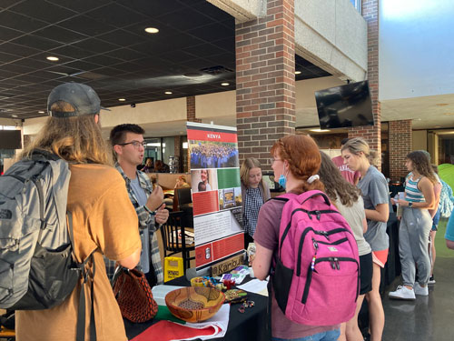 People gather around the Kenya booth