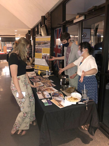Students gather at Global Fest booth.
