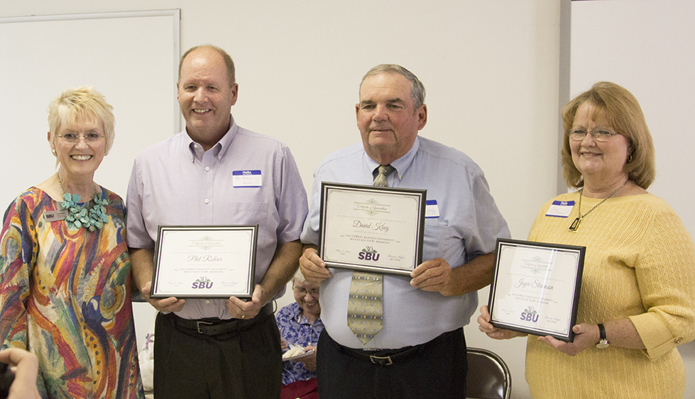 Certificates presented to the three original Mountain View campus faculty.