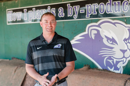 SBU Baseball coach Chris Martin talking in dugout