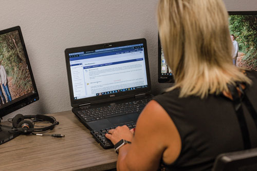 Angie works on laptop