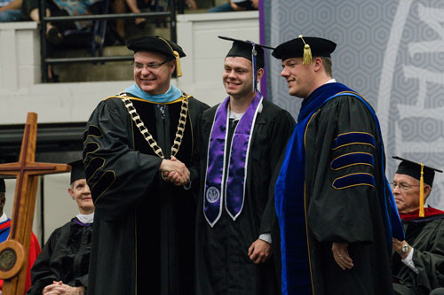 Tyler Dickinson receives Life Beautiful award from Dr. Eric Turner and Dr. Lee Skinkle