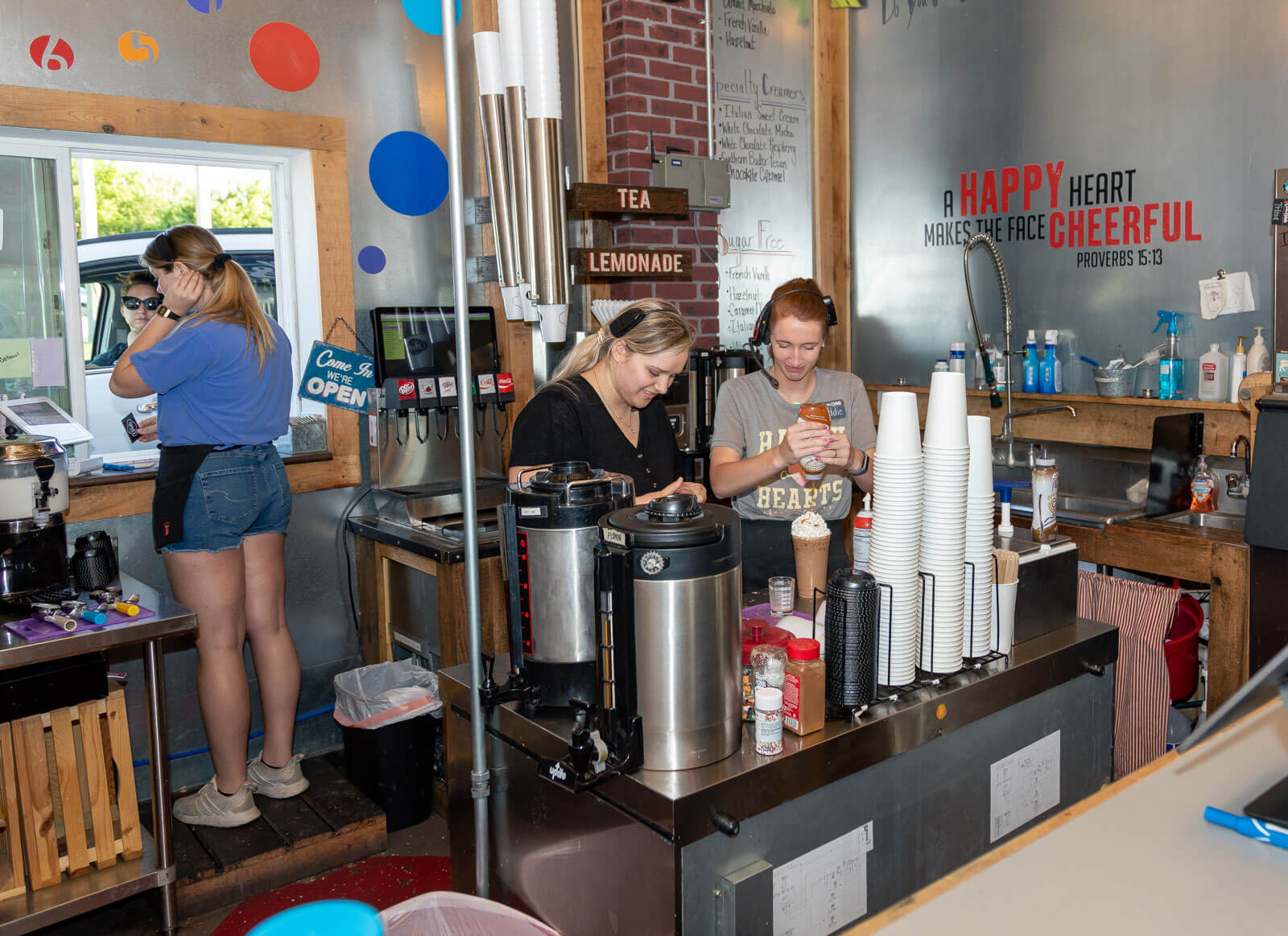 female baristas prepare drinks at Creator Delights