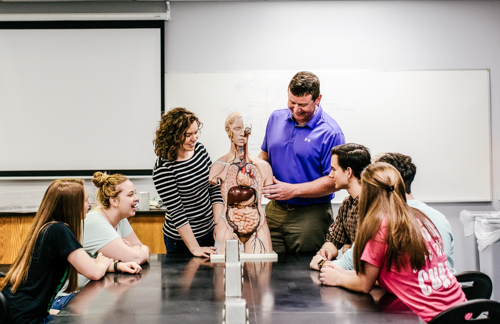 Students in classroom learning about anatomy with Dr. John Murphy