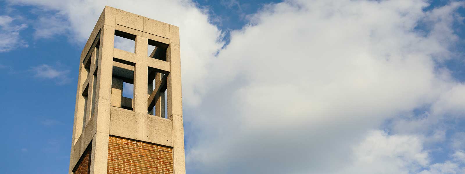 bell tower against blue cloudy sky