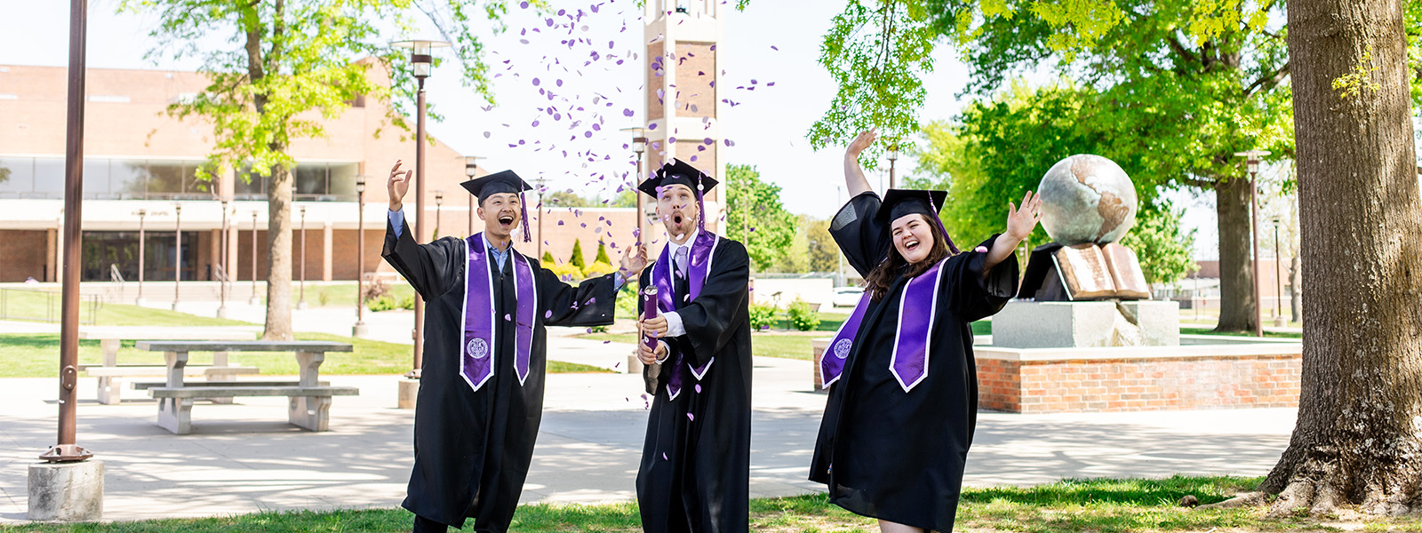 Honors Program celebrating graduation with confetti. 