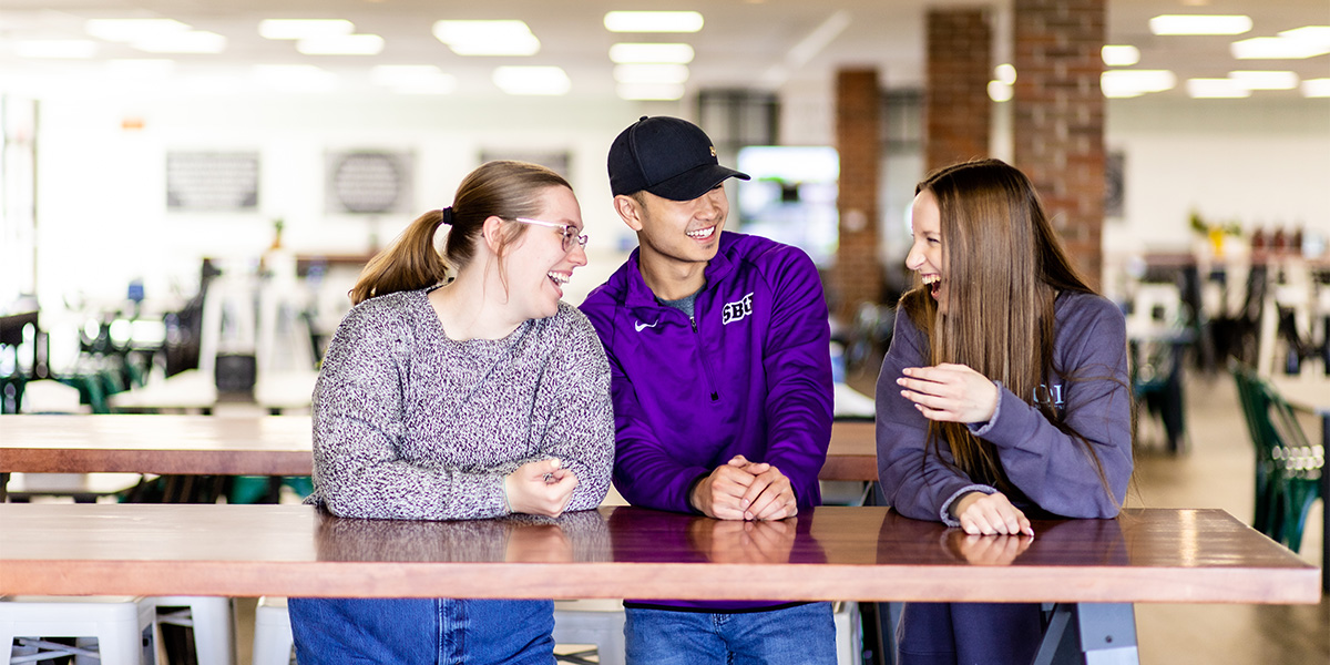 students at the Marketplace talking