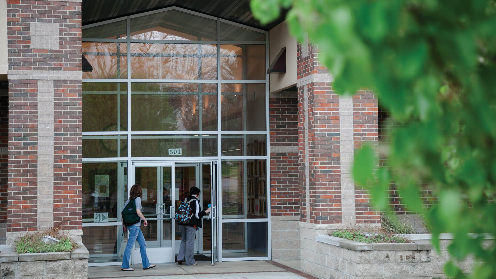 students walking into front door of Salem campus building