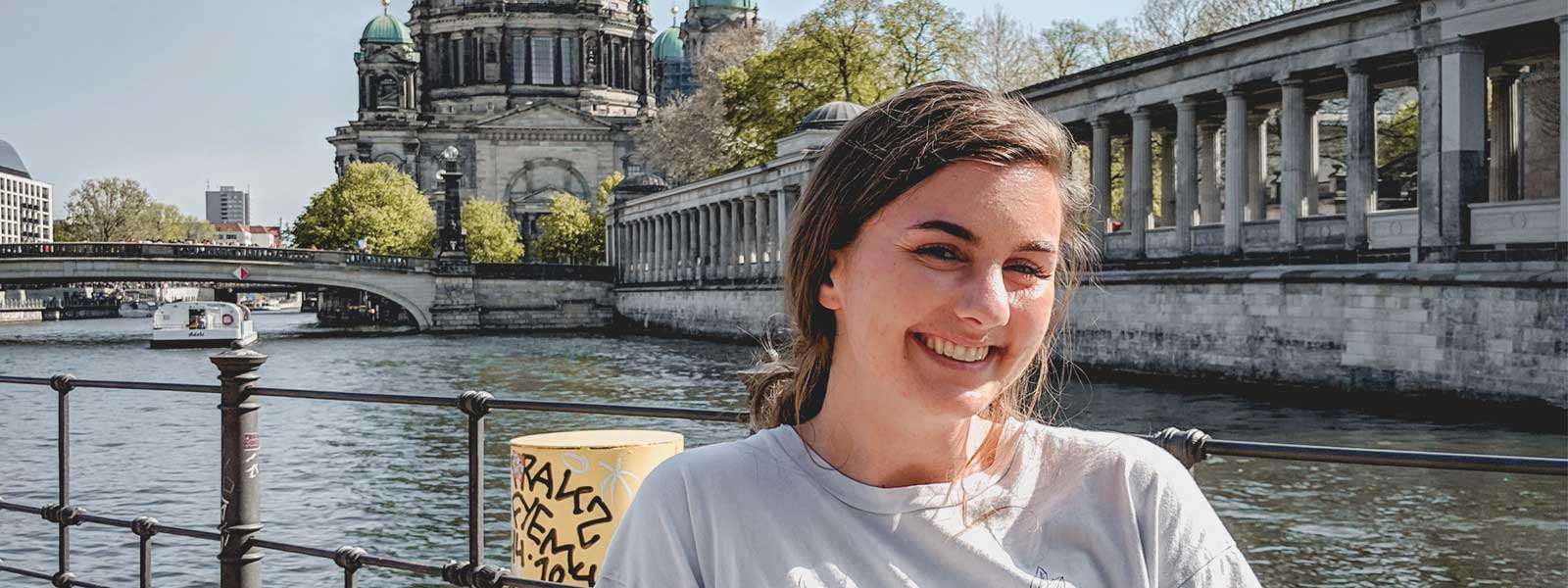 female student in front of a historic building in Italy
