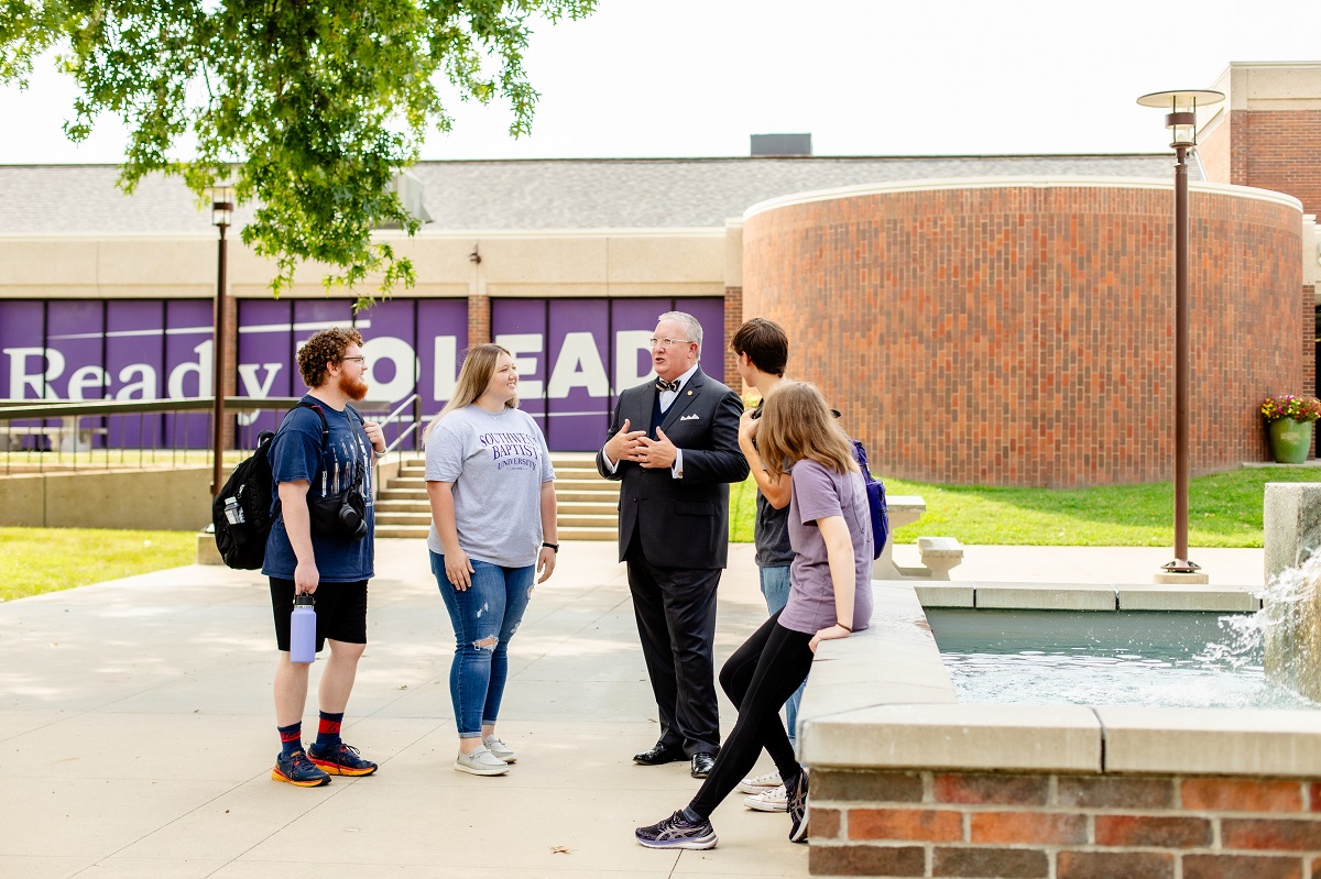 photo of president melson with students