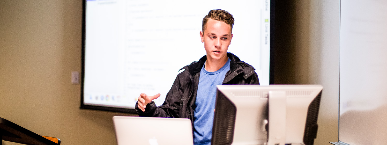 student teaching at the front of the classroom