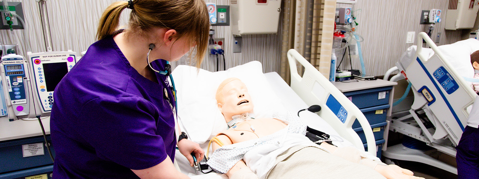 nursing students practice with IVs