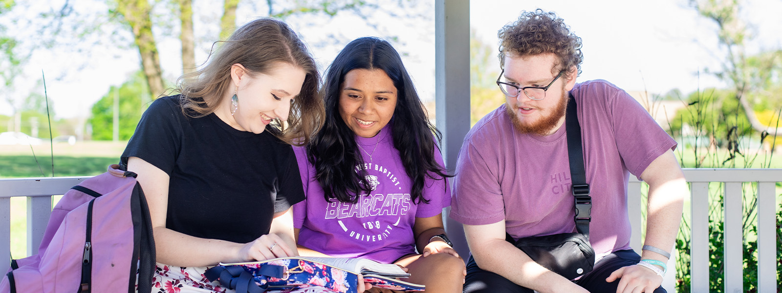 group of students concentrate on chemistry experiment