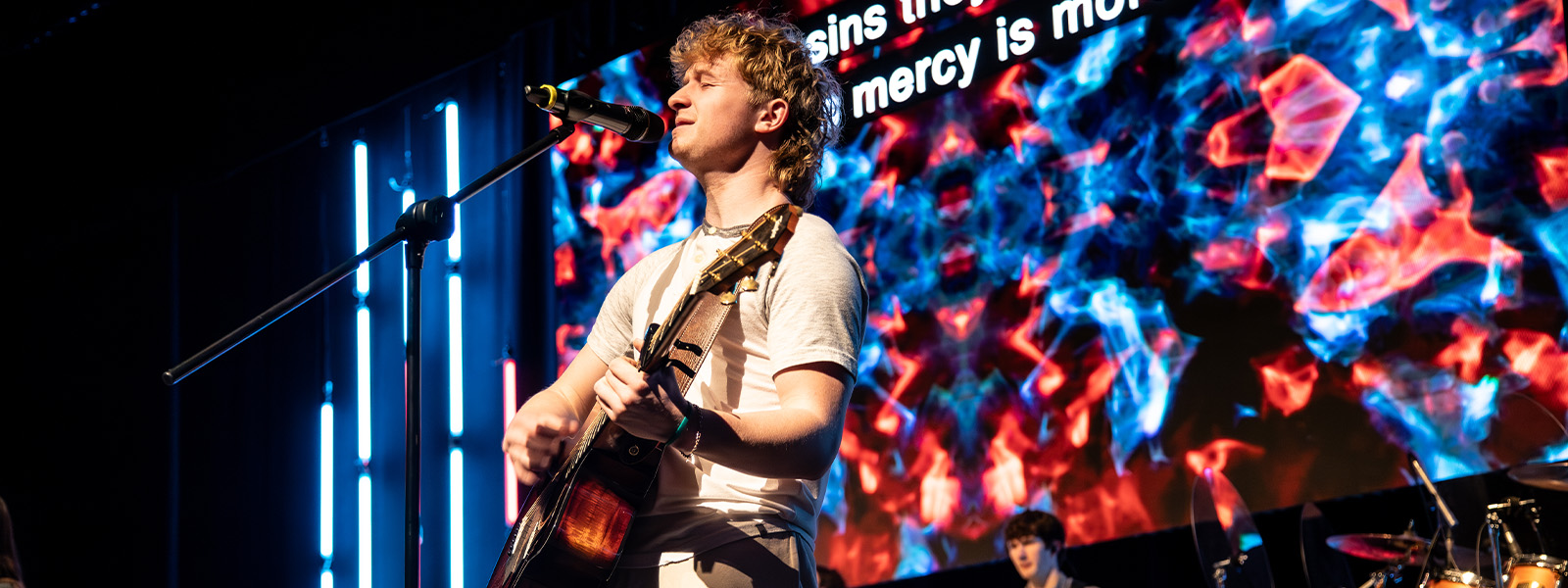 student-led worship service at outdoor amphitheater
