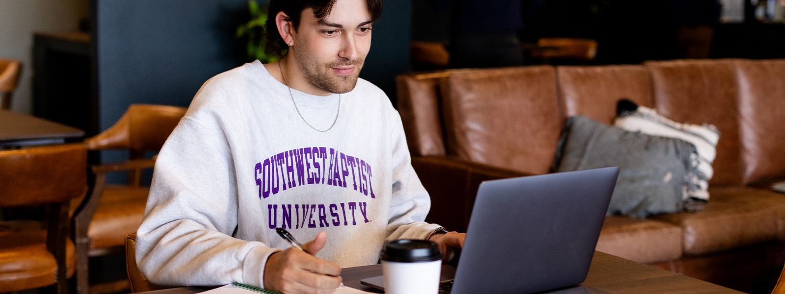 male businessperson sitting at desk