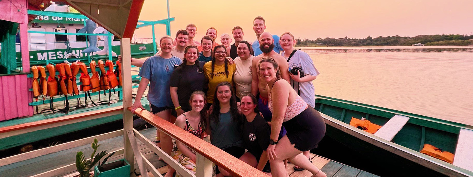 SBU students pose for photo with group of kids in Dominican Republic