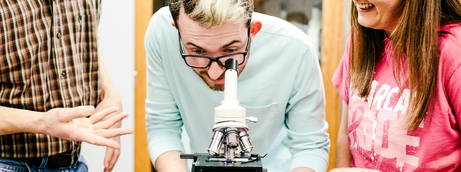 students work on physics experiment