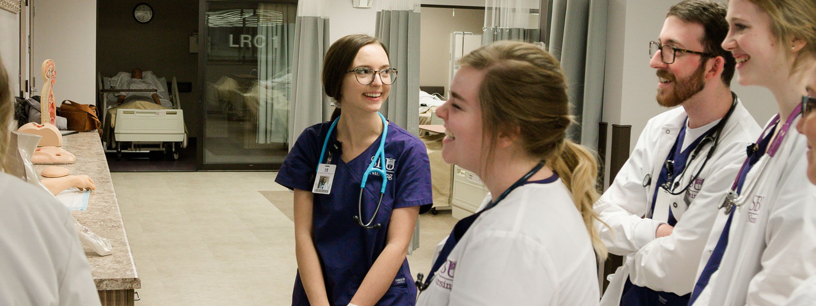 students interact in nursing training center