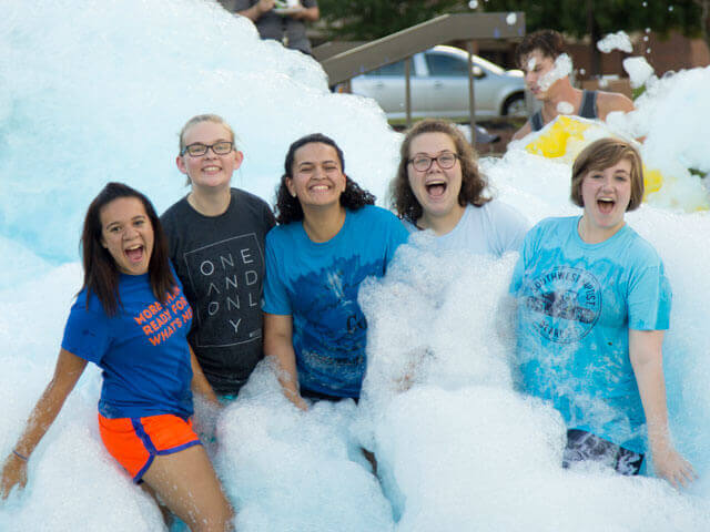 Youth playing with bubbles machine