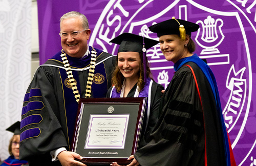 girl graduating with honor's during spring commencement